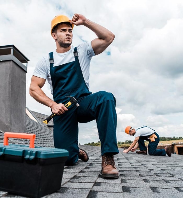 selective-focus-of-handsome-handyman-touching-helm-resize.jpg